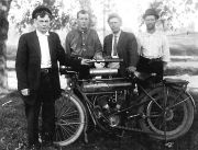 Four gentlemen with a ca. 1911 Flying Merkel motorcycle. From left to right James (Tuck) Ely, Charles Ely, friend, and Samuel Ely. By courtesy of Steve Schwengels, Milwaukee WI, Grandson of Charles Ely in the picture.
